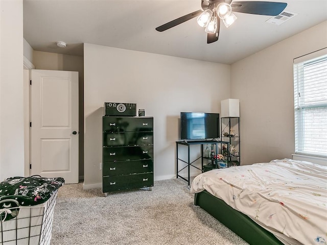 carpeted bedroom with ceiling fan