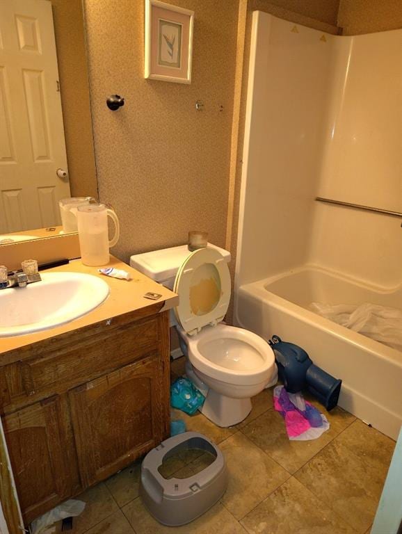 full bathroom with tile patterned floors,  shower combination, toilet, and vanity