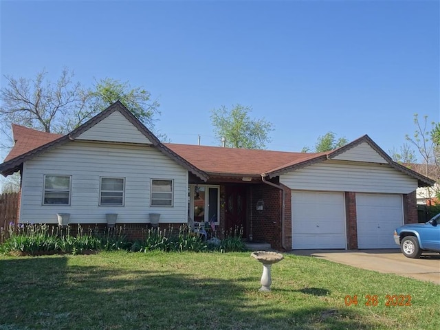 ranch-style home with a garage and a front yard