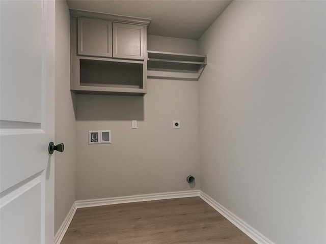 washroom featuring cabinets, washer hookup, dark hardwood / wood-style flooring, and electric dryer hookup