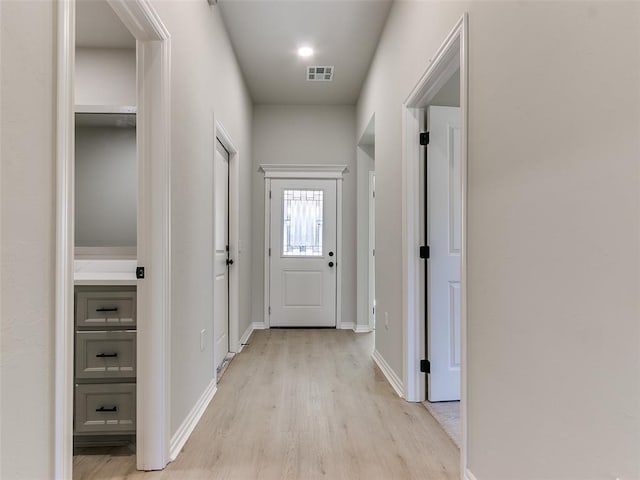 hallway with light wood-type flooring