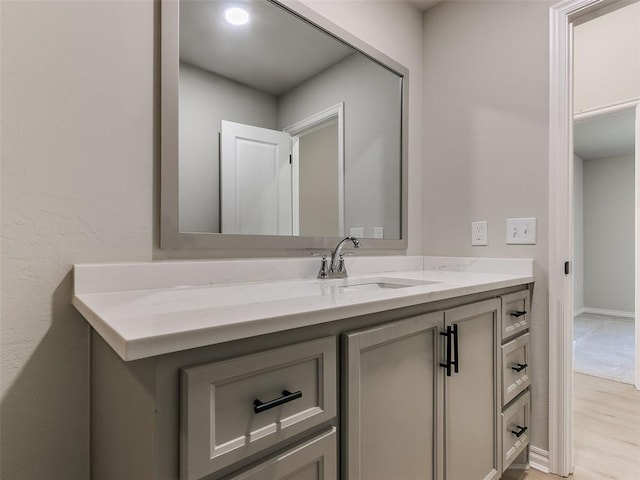 bathroom featuring hardwood / wood-style flooring and vanity