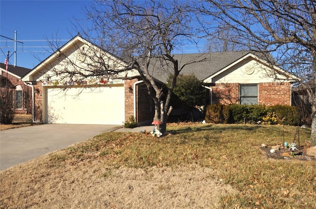 ranch-style house featuring a garage and a front lawn