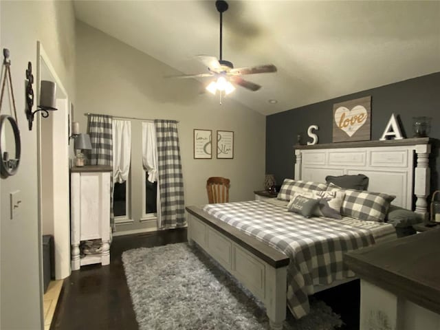 bedroom featuring dark wood-type flooring, ceiling fan, and vaulted ceiling