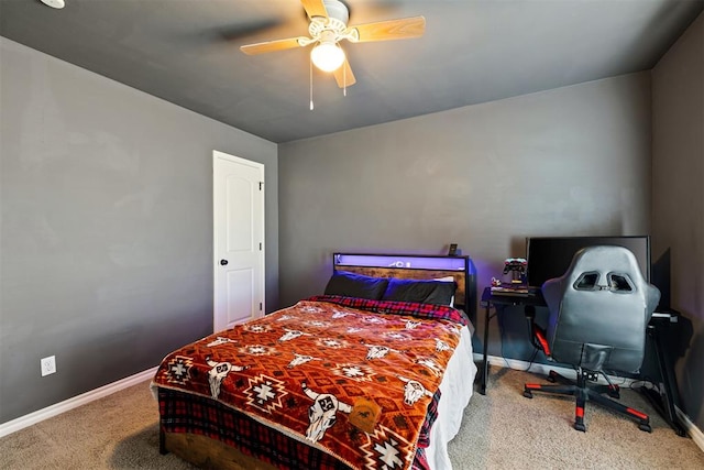 bedroom featuring ceiling fan and carpet