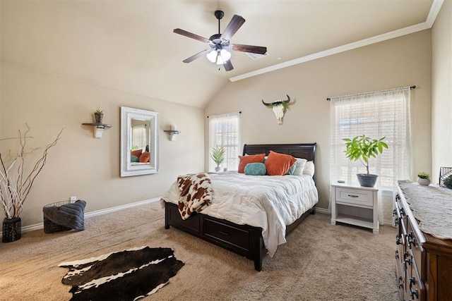 carpeted bedroom with crown molding, lofted ceiling, and ceiling fan