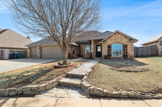 ranch-style home with a garage and a front yard