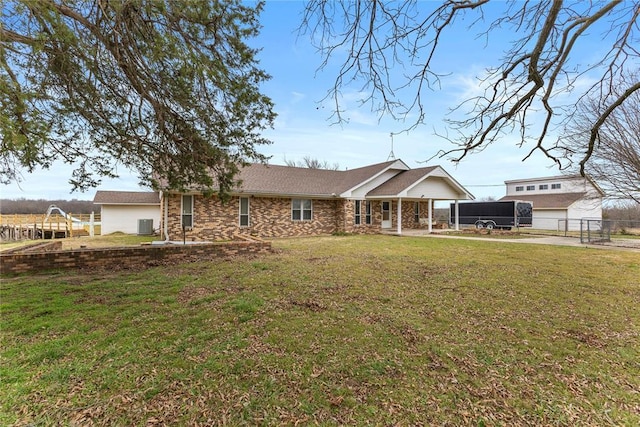 single story home featuring fence, a front lawn, and central AC