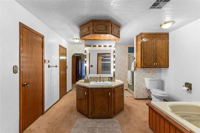 bathroom featuring wallpapered walls, a stall shower, a textured ceiling, toilet, and visible vents