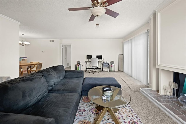 carpeted living room featuring crown molding, ceiling fan with notable chandelier, and a textured ceiling