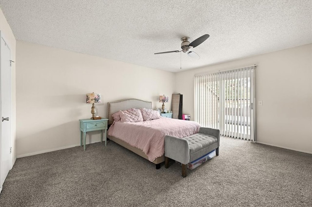 carpeted bedroom featuring ceiling fan and a textured ceiling