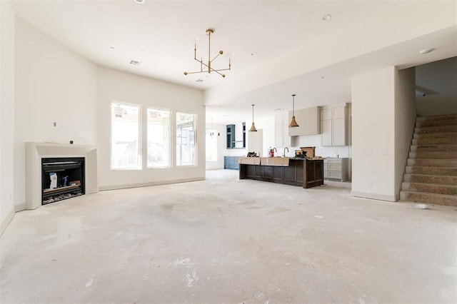 living room featuring a notable chandelier