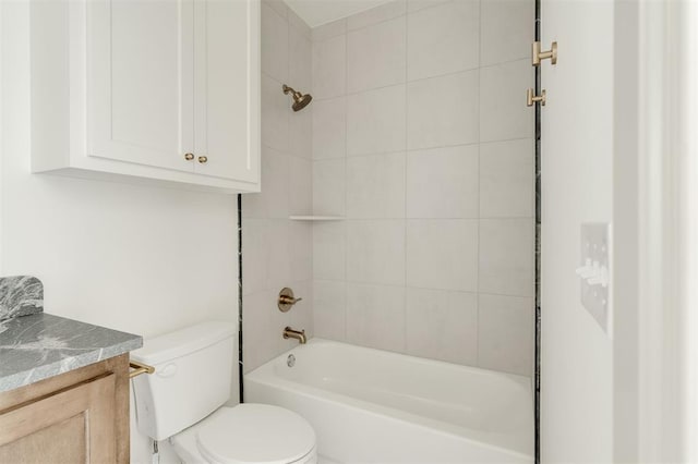 full bath featuring toilet, vanity, and shower / tub combination