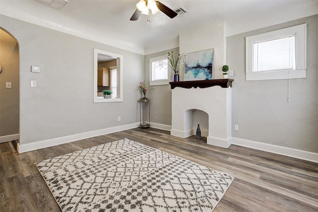 interior space with hardwood / wood-style floors and ceiling fan