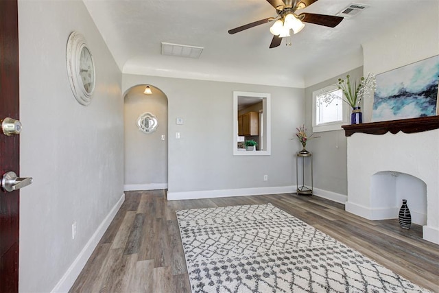 living room featuring hardwood / wood-style flooring and ceiling fan