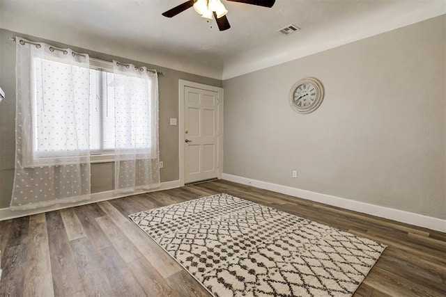 foyer featuring dark hardwood / wood-style floors and ceiling fan