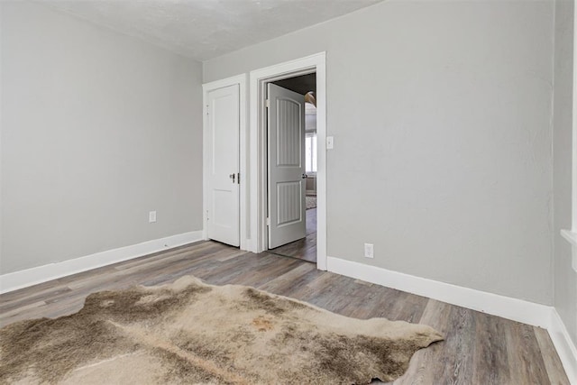 unfurnished bedroom with wood-type flooring