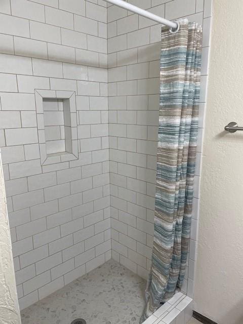 bathroom with a shower with shower curtain