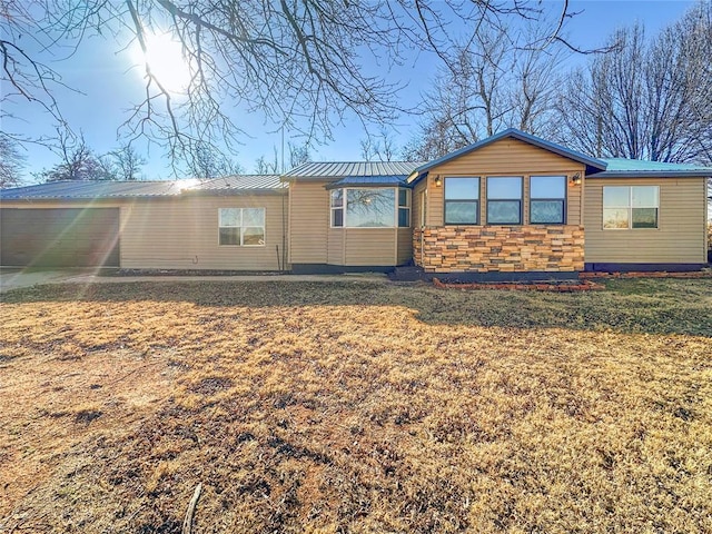 rear view of house with a yard