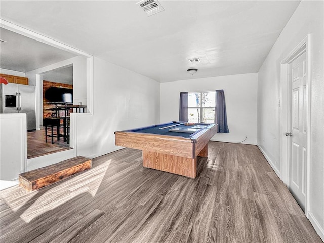 game room with wood-type flooring and pool table