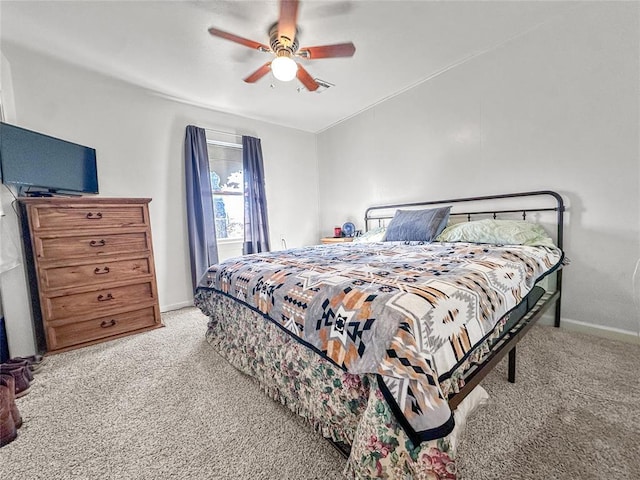 bedroom with light colored carpet and ceiling fan