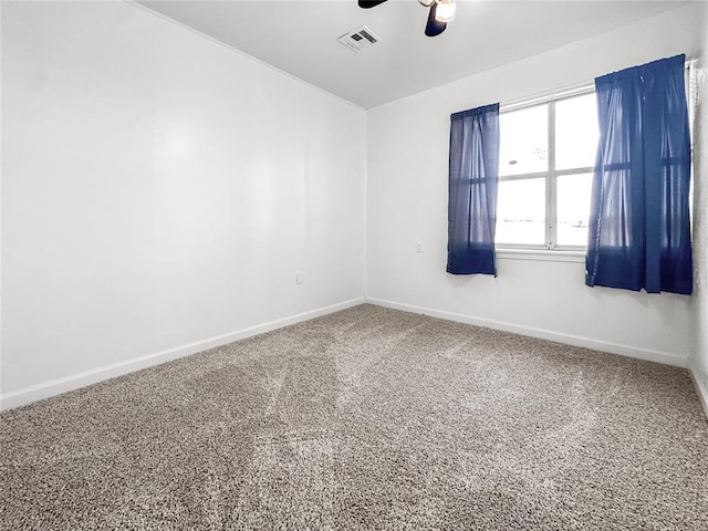 empty room with ceiling fan and carpet flooring