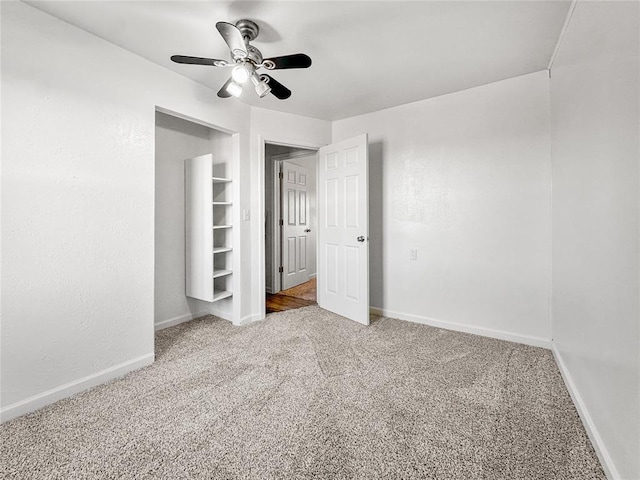 unfurnished bedroom with ceiling fan and carpet