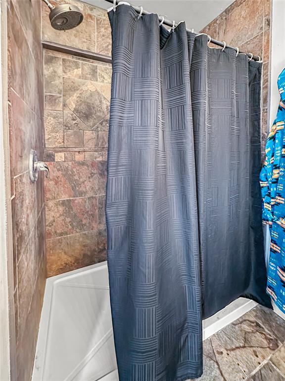 bathroom featuring walk in shower