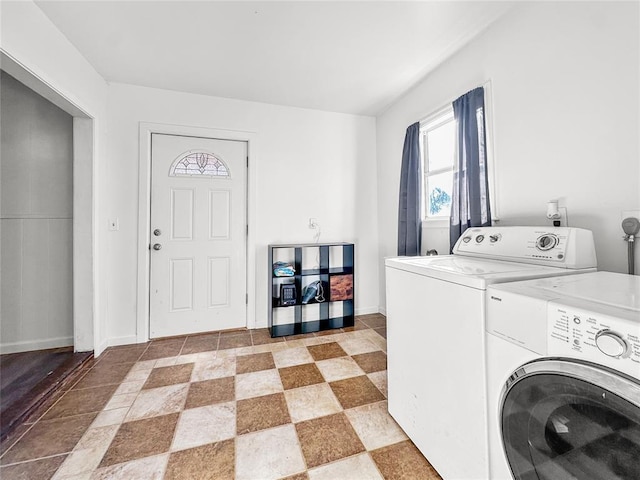 washroom with washing machine and clothes dryer