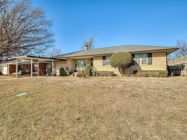 single story home featuring a garage and a front lawn