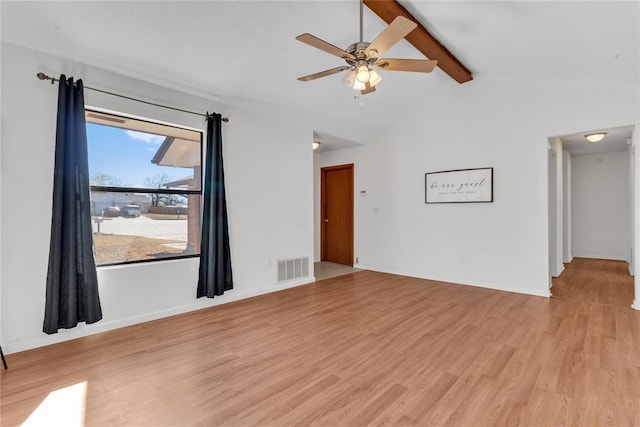 interior space with vaulted ceiling with beams, ceiling fan, and light hardwood / wood-style flooring