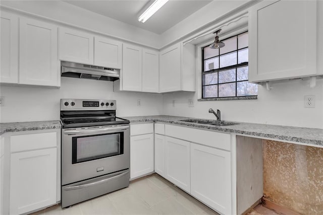 kitchen featuring white cabinetry, light stone countertops, sink, and electric range