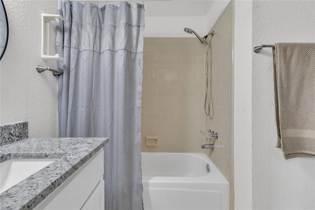 bathroom with shower / bath combination with curtain and vanity