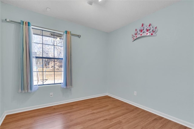 spare room with light wood-type flooring