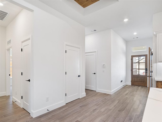 foyer entrance with light hardwood / wood-style flooring