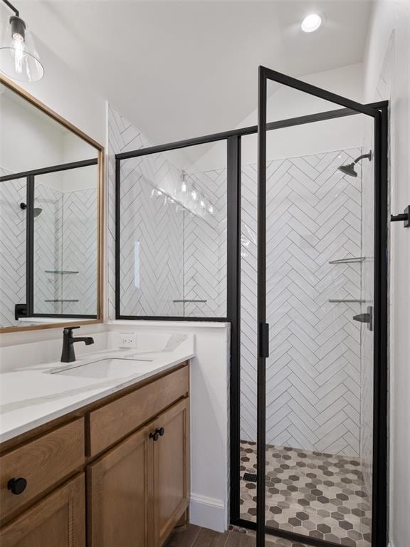 bathroom with vanity and an enclosed shower