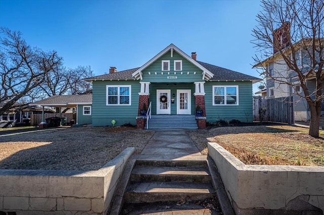 view of front of property featuring a carport