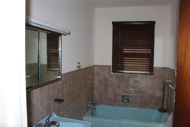 bathroom with sink and a bathing tub