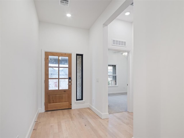 entrance foyer featuring plenty of natural light, visible vents, and light wood-style floors