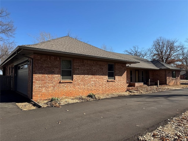 view of side of home with a garage