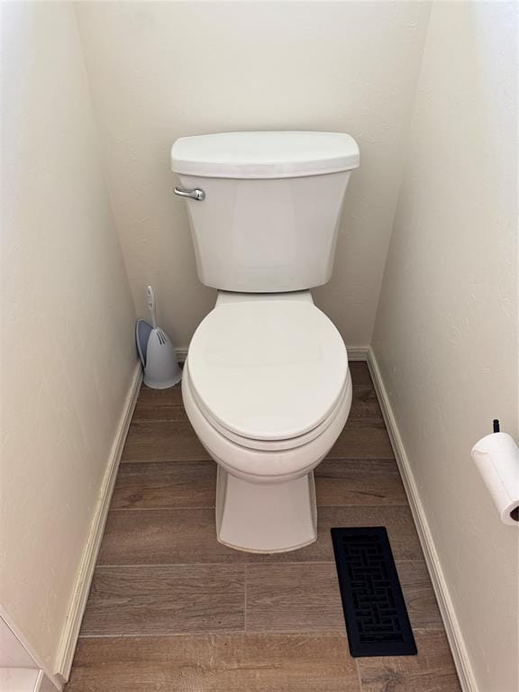 bathroom featuring toilet and hardwood / wood-style floors