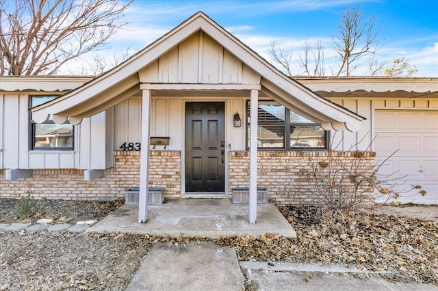 doorway to property with a garage