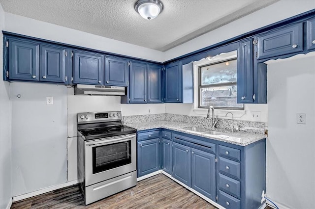 kitchen with sink, blue cabinetry, light stone countertops, and stainless steel electric range oven