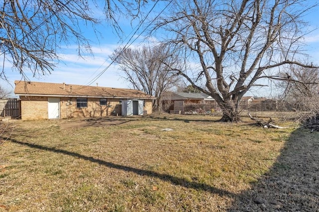 rear view of house with a lawn