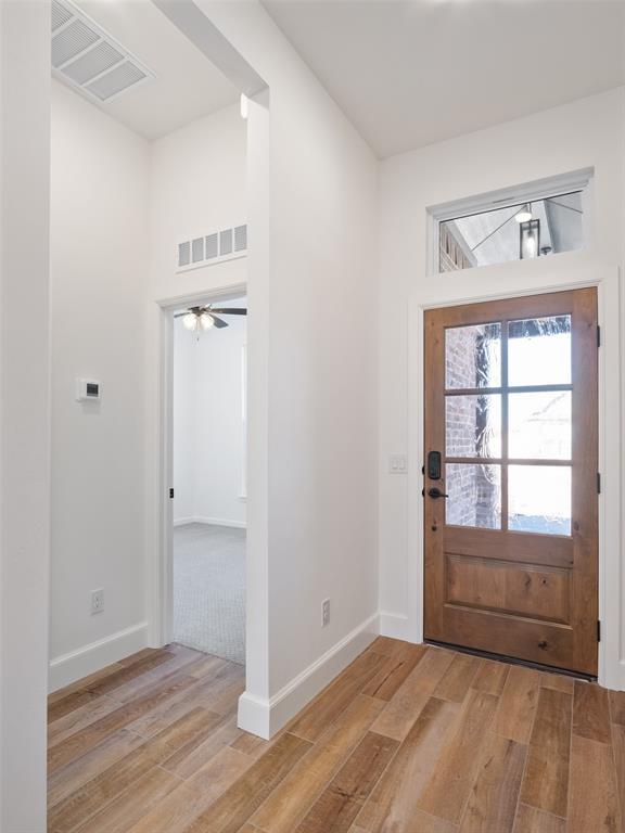 foyer with light hardwood / wood-style flooring