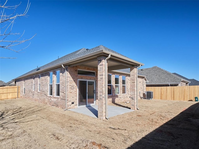 rear view of house with a patio and central AC unit