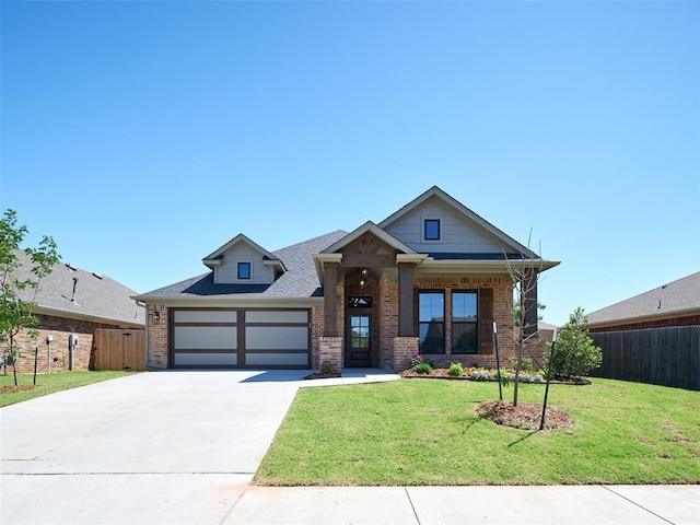 2524 NW 179th St, Edmond, OK 73012 - view of front of home featuring brick siding, concrete driveway, and an attached garage