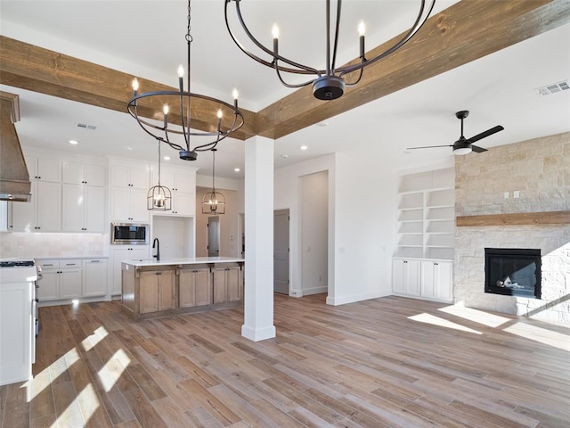 2524 NW 179th St, Edmond, OK 73012 - kitchen featuring stainless steel microwave, open floor plan, a chandelier, baseboards, and recessed lighting