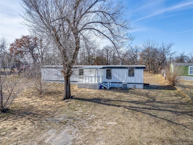 exterior space with fence and a deck