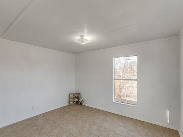 unfurnished room featuring baseboards and ornamental molding